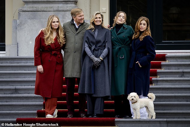 Part of the family!  Mambo posed perfectly for a family photo next to Princess Amalia, King Willem-Alexander, Queen Máxima, Princess Ariane and Princess Alexia