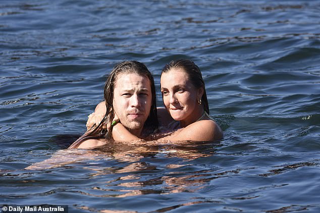 They cuddled in the ocean on Friday as they put on a very intimate show during their sun-soaked day out