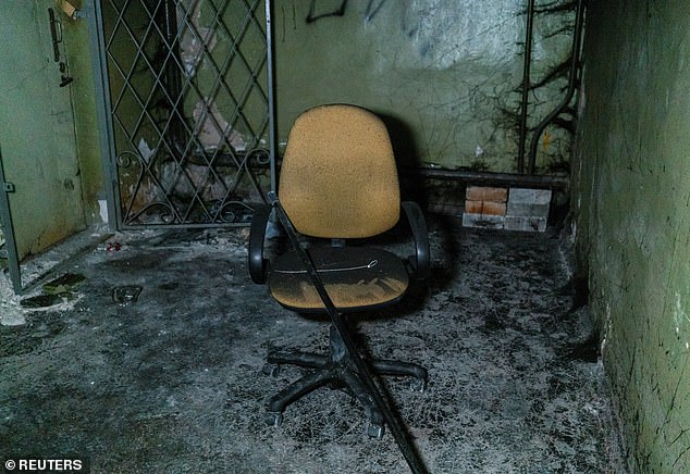 Plastic torture straps and a broken chair are seen in a basement of an office building where prosecutors say 30 people were held for two months during a Russian occupation amid Russia's attack on Ukraine, in Kherson, Ukraine, December 10, 2022