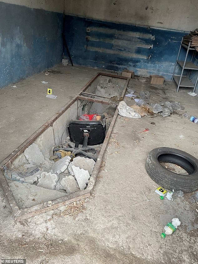 A garage adjacent to a courthouse in the village of Bilozerka, in Ukraine's southern Kherson region, December 2, 2022, where Ukrainian authorities say Russian forces were stationed and unlawfully detained civilians