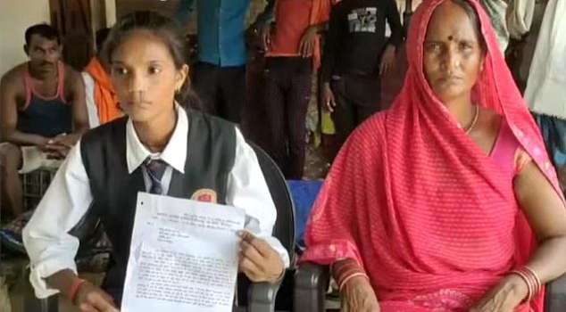 Pinki (left), along with thirty other residents of her village, were told to leave their homes and received a demolition notice last year