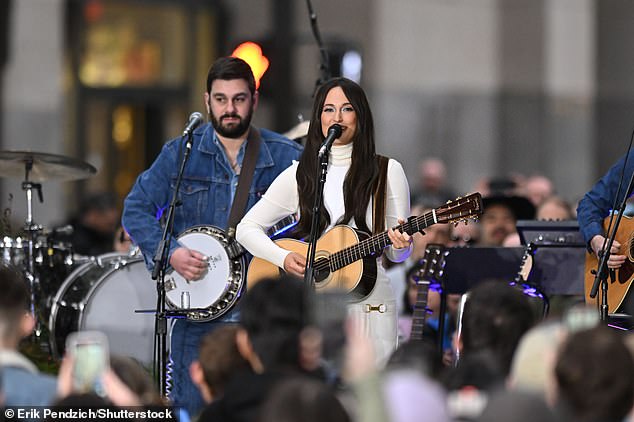 She was in full make-up for the performance, with her signature long brunette hair on display as she wore a preppy white polo shirt