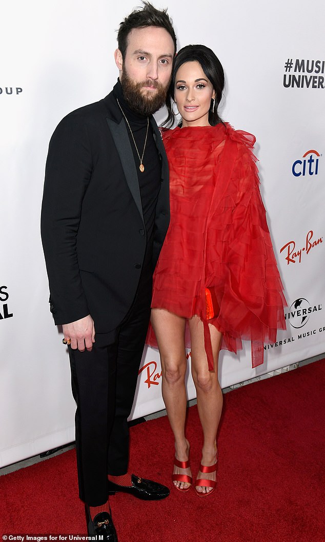 The pair were first linked in June 2021, almost a year after Kacey and her songwriter husband Ruston Kelly announced their divorce;  Kacey and Ruston are pictured in 2019