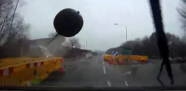 The ball heads straight for the car and a split second later it crashes into the windshield of the motorcycle, completely shattering the glass and front fascia.