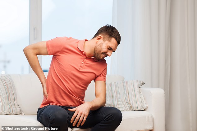 Sleeping on your stomach can leave you with back and neck pain the next day, according to experts (stock image)