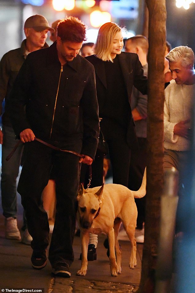 As they left the restaurant, the A Star Is Born director was seen walking a dog who didn't seem happy to be in such great company.