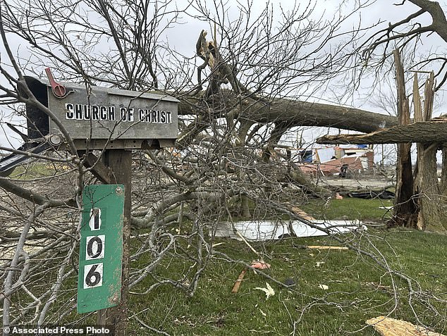 The remains of a destroyed church are seen in Winchester, Ind., on Friday, March 15, 2024, after it was destroyed during a storm that hit the area Thursday evening.  (AP Photo/Isabella Volmert)