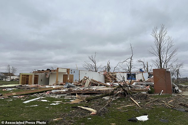 The remains of a destroyed church are seen in Winchester, Ind., on Friday, March 15, 2024, after it was destroyed during a storm that hit the area Thursday evening.  (AP Photo/Isabella Volmert)