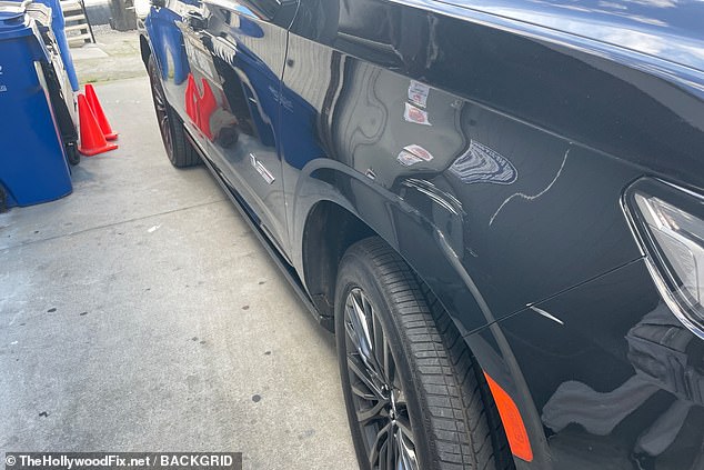 White scratches remained on the shiny black truck