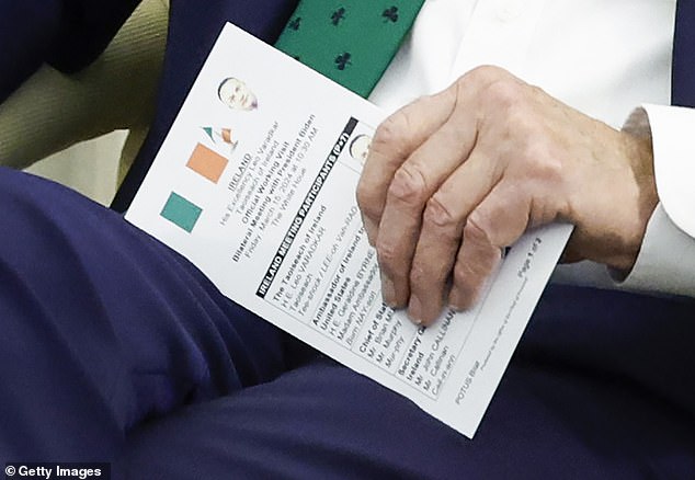 Biden turned over his note card, which showed photos and the flag of the Republic of Ireland