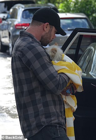 Around noon local time, one of her cats looked visibly distressed, but was safely wrapped in a blanket and carried by a man