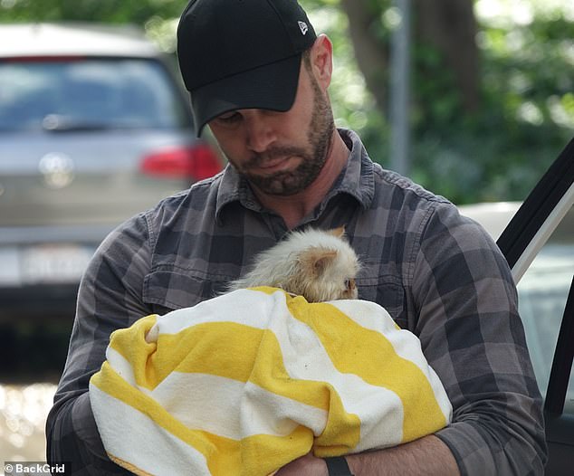 Her precious cat was seen looking around intently