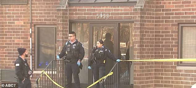 Pictured: Officers outside the family's apartment complex investigate the crime scene