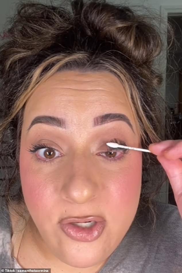 She then took the edge of the cotton swab and pressed it repeatedly against her lashes, explaining that this was a good alternative to a metal eyelash curler.