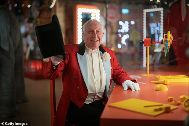 Veteran British ringmaster Norman Barrett MBE poses next to an interactive exhibition of himself at Showtown, Blackpool's first ever permanent museum