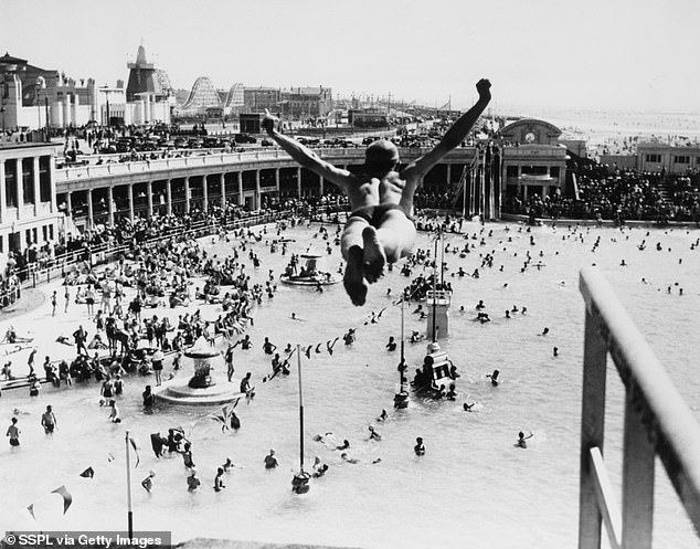 Man dives into a busy swimming pool in Blackpool in August 1937