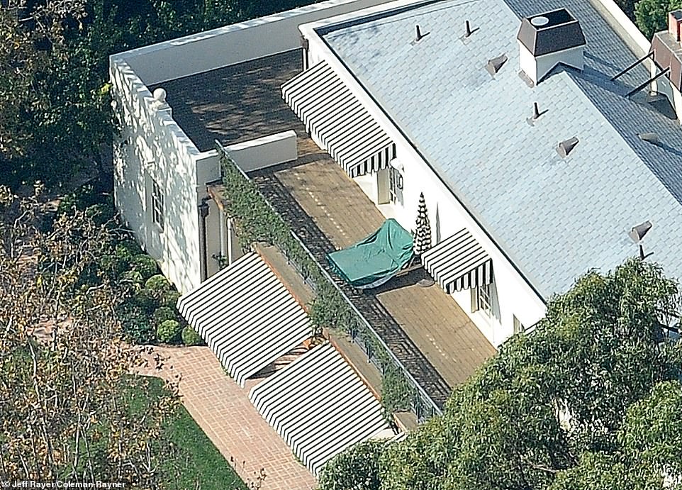 Aerial photos show the music superstar has a private double sunbed in the garden of her sprawling home