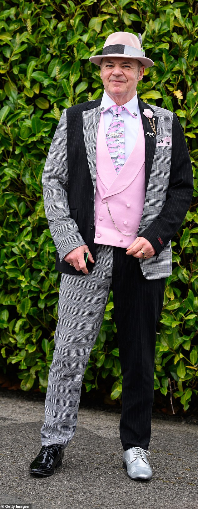 One reveler wanted to stand out from the crowd with his ensemble, which featured different patterned trouser legs, odd shoes and a mismatched vest