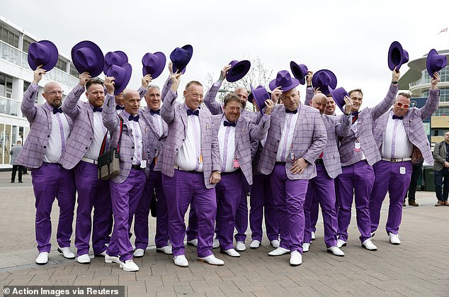 One group coordinated their outfits by all wearing purple shirts and ties.