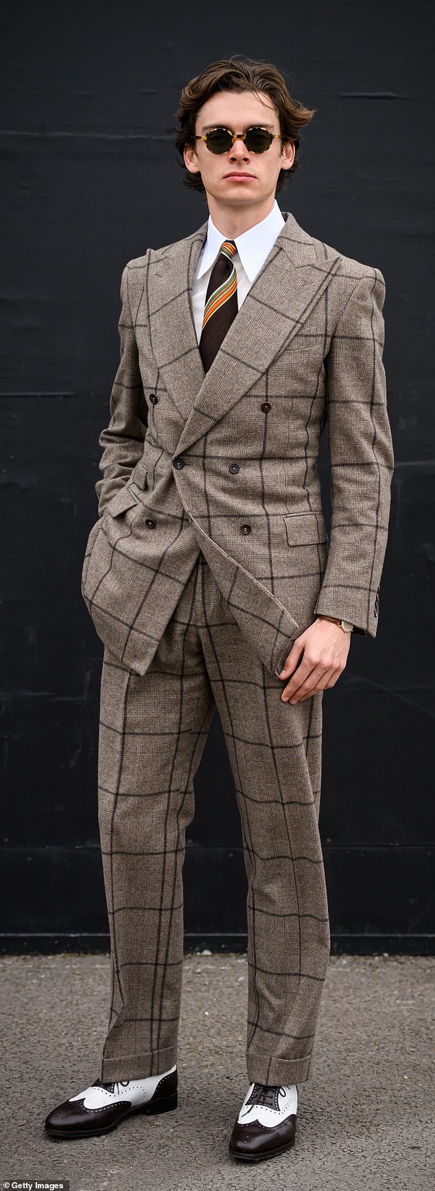 Mathias Le Fevre oozed style as he attended the popular race, opting for monochrome polished shoes, a smart checked suit and sunglasses