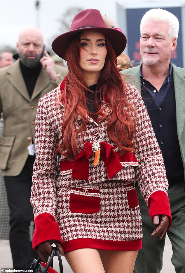 Woman in red!  One reveler paired her hair and outfit with a move that certainly turned heads