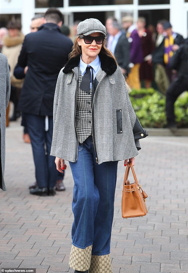 Jeans are now allowed at the event, with this spectator wearing wide-leg denim, alongside a houndstooth waistcoat and a checked jacket