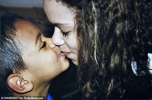 Adrian is seen here kissing his eldest sibling, half-sister Keiona 'Kiki' Doctor, in 2012