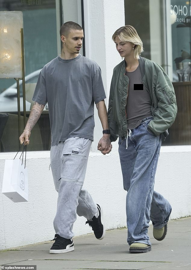 1710670230 661 Romeo Beckham is hand in hand with braless Mia Regan as on off