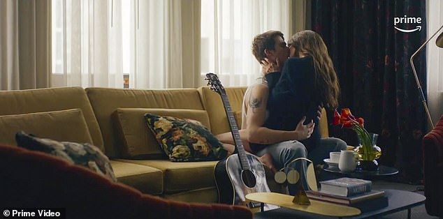 Here they kiss like teenagers on a couch next to his guitar