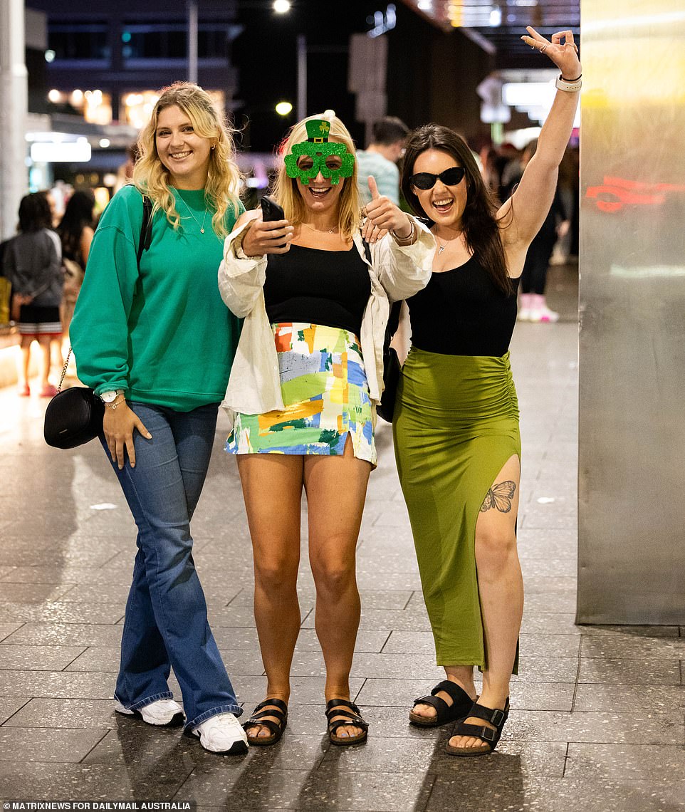 Revelers dressed in green attire and completed their look with oversized, new glasses
