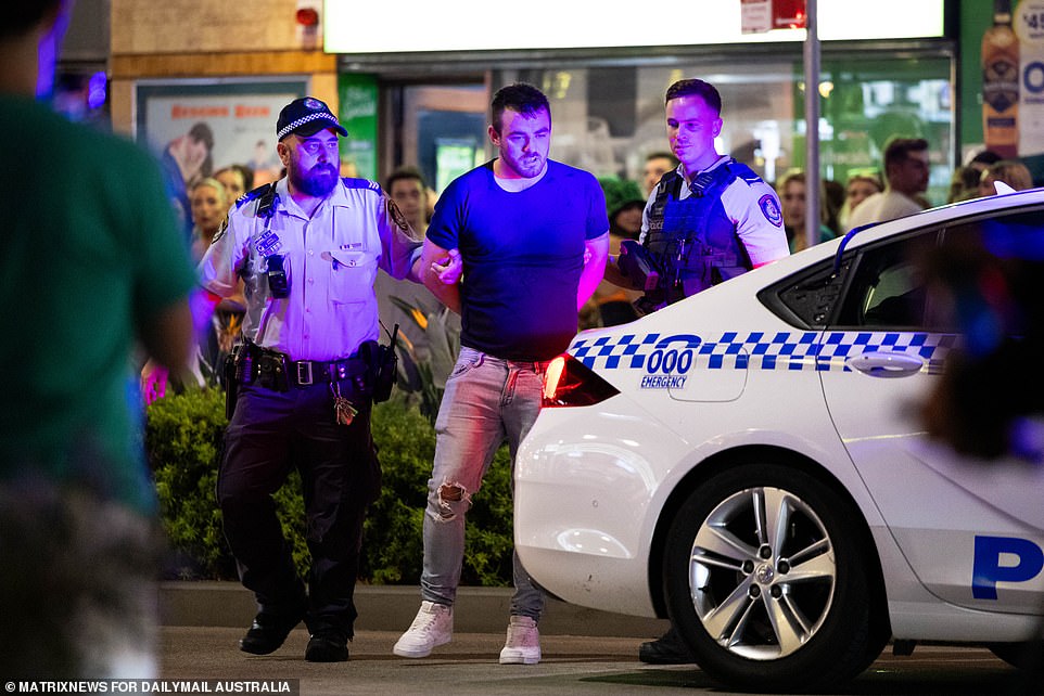 Police dragged the partygoer away to a waiting police car