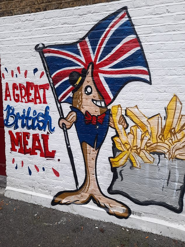 Greenwich Council said they had received a 'number of complaints' about the mural (pictured), which features the phrase 'A Great British Meal'.  They said it was an 