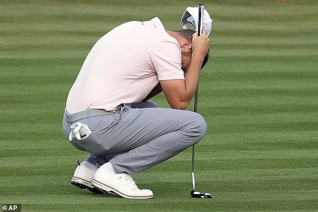 Clark's putt, just inside 18 feet, somehow dipped into the cup on the left and came out