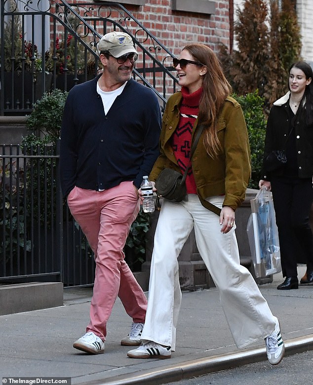 The Mad Men actor, 53, looked preppy in pink pants with a white t-shirt and a navy blue vest