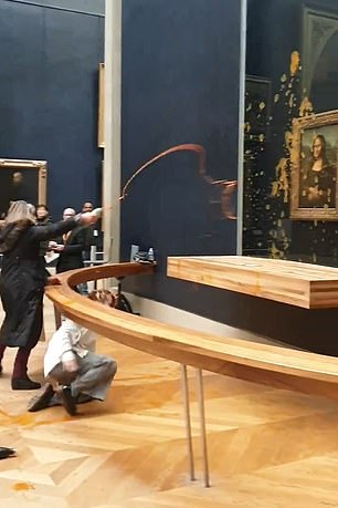 This is the moment when the activists throw soup at the Mona Lisa