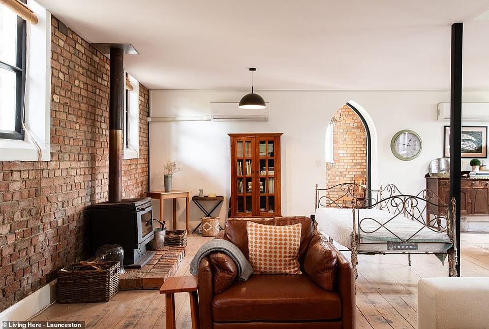 Through the arched front door and past the small entrance hall, guests are greeted by the enormous lounge and dining room with multiple seating areas