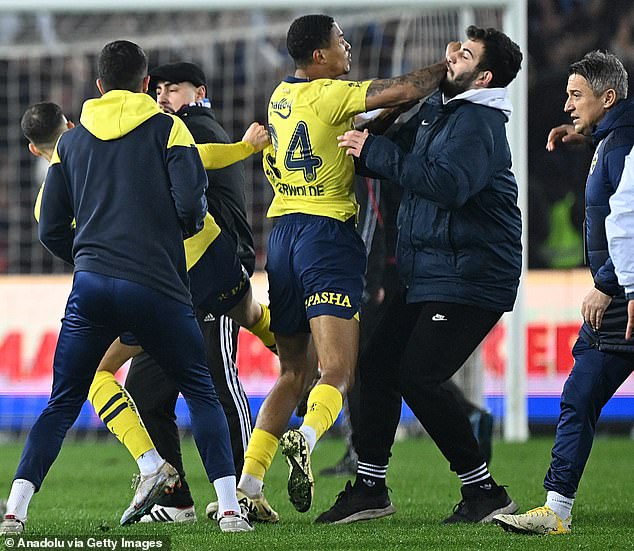 Fenerbahce's players fought back as they tried to defend themselves