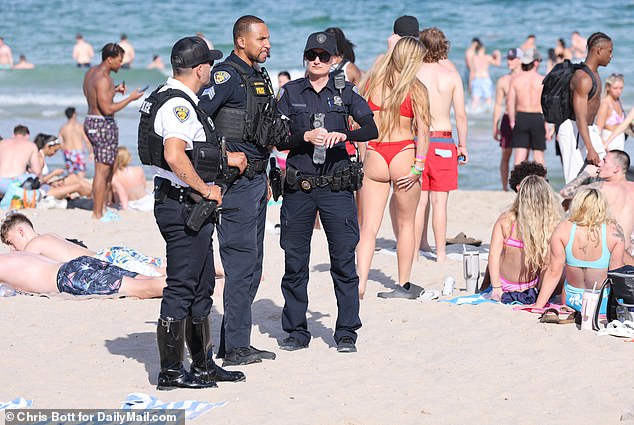 Police patrol a beach in Fort Lauderdale during spring break on Tuesday, March 12, 2024