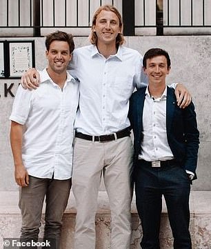 Mr. East is pictured (right) with friends