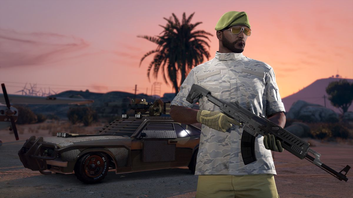 A GTA Online player poses with his neat gun, next to a sunset sky with a palm tree and his expensive super car in the background.