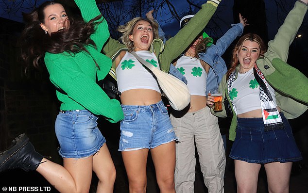 LEEDS: Four students are jumping for joy in green shamrock-themed outfits