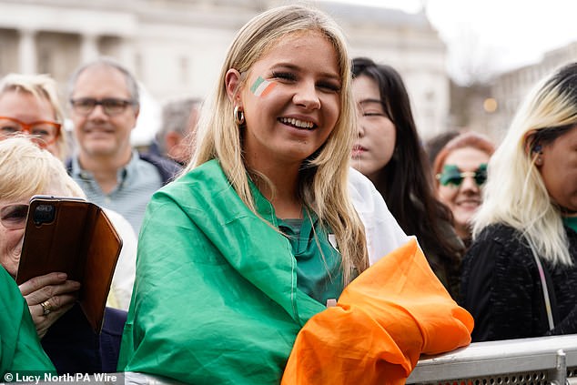 LONDON: A woman wrapped in an Irish flag smiles as the parade goes by