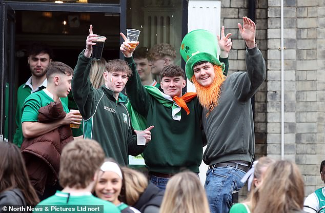 NEWCASTLE: Revelers gather outside a pub as the festivities got underway