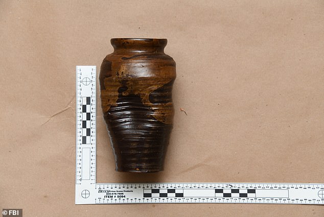 The 22 objects found in Massachusetts included this vase and six painted scrolls from the 18th to 19th centuries, three of which were in one piece and appear to have been divided into three pieces.