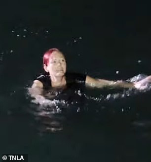 New video obtained by DailyMail.com shows Reynolds punching the water as he attempts to swim back to shore before being rescued by sheriff's deputies