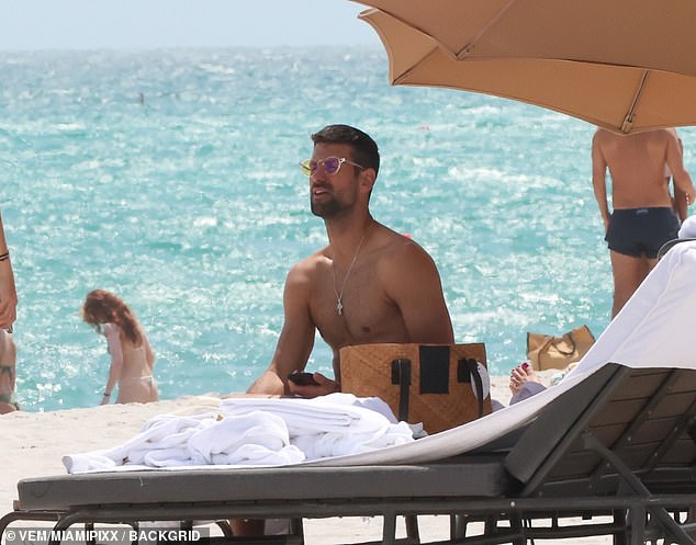 Djokovic, 35, took some vitamin D while soaking up the sun on the once-clear Miami waters