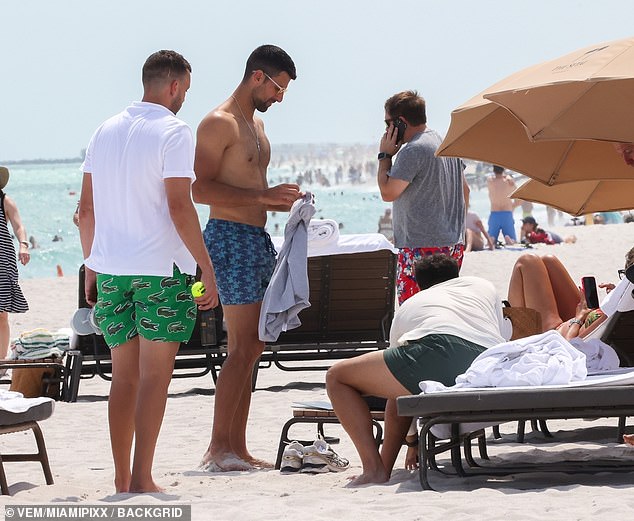 He proved that age is just a number by showing off his muscular physique in a blue swimsuit