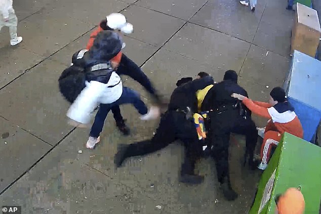 A mob of migrants attacked police officers sent to disperse them in Times Square on January 27
