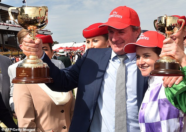 Weir is pictured in happier times after winning the 2015 Melbourne Cup, as Michelle Payne (right) rides 100/1 outsider Prince of Penzance to victory