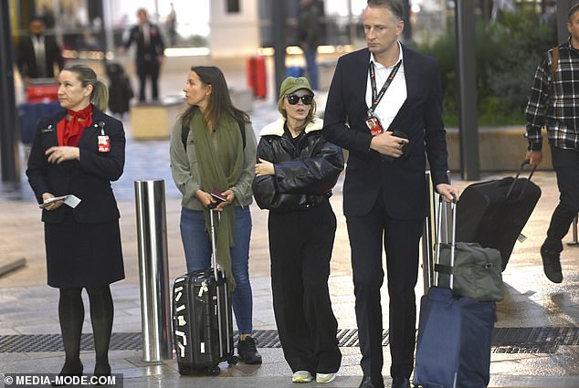 Despite the many layers she wore, Kylie seemed chilly on the Sydney night